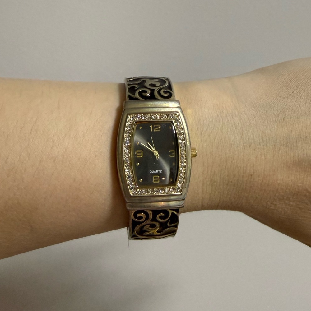 Elegant JST Black and Gold Watch